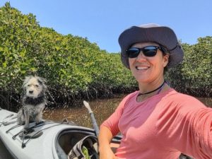 Tour Guide and Naturalist Victoria Africano Sea Kayaking through Mangroves in La Paz, Baja California Sur, with Mexican Street Dog Pichi Pangui